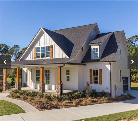 white farmhouse with wood shutters